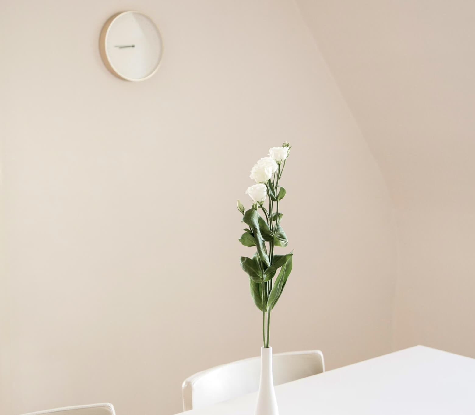 A flower vase on a white table